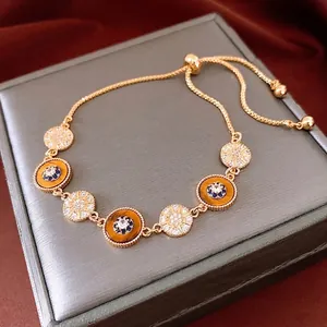 Bracelet vintage plaqué or 18K avec œil de tigre ajustable et breloques œil de protection