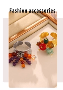 Close-up of gold and silver beaded rings with colorful natural stones and 18k plating