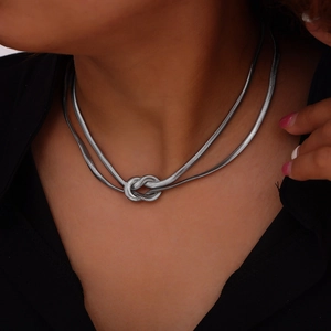 Double-layer snake bone chain necklace with punk knot design in polished silver finish