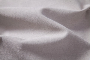 Macro shot of breathable cotton linen fabric texture on these casual autumn trousers