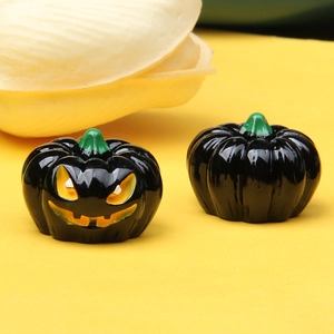 Macro shot of 3D Halloween Jack-o'-lantern miniature with glow detail and smooth surface
