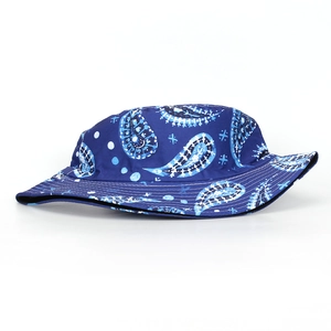 Detail of navy blue bucket hat with white paisley patterns and reinforced stitched brim