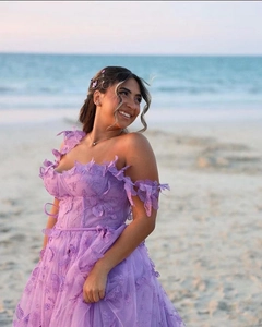 Detail of lavender tulle dress featuring 3D butterfly appliques and lace embroidery