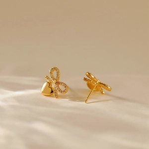 Elegant 18K gold-plated bowknot and heart drop earrings with shimmering zircon accents