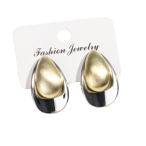 Minimalist gold and silver two-tone teardrop earrings with brushed metal texture