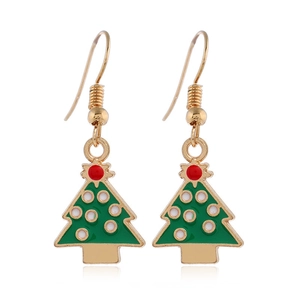 Close-up of festive green Christmas tree earrings with colorful enamel and gold hooks
