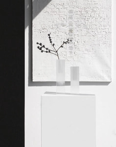 Detail of square frosted acrylic vases with minimalist shadows and artistic background