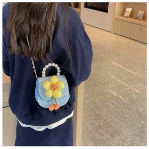 Blue fabric kids mini bag with pearl handle, floral decor, and golden chain strap