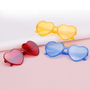 Colorful heart-shaped fashion sunglasses in red yellow and blue for party wear