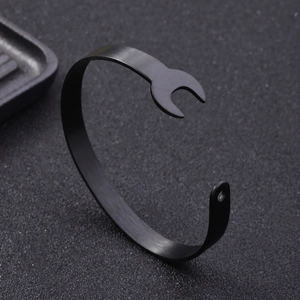 Creative punk style black stainless steel open bracelet featuring a unique wrench design