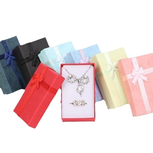 Colorful jewelry gift boxes with bow ribbons for rings and necklaces on white background