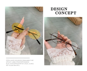 Dettaglio degli occhiali da sole ovali tartarugati con lenti gialle e design alla moda