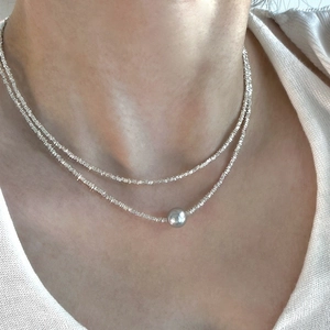 Minimalist S925 silver double-layer necklace featuring a round metal bead pendant