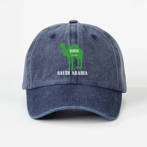Detailed close-up of a navy washed denim baseball cap featuring a Saudi Arabia camel logo