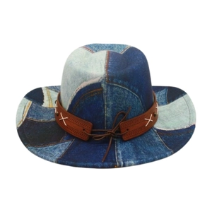 Detail of vintage patchwork denim cowboy hat with leather band and cross stitching