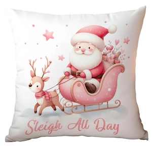 Pink Christmas pillow with Sleigh All Day text and cute Santa illustration on white