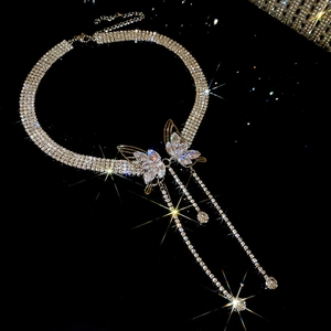 Macro view of crystal butterfly choker featuring elegant sparkling tassel pendants