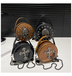 Detail of mini punk crossbody bags featuring gothic skulls, metal rivets, and silver crosses