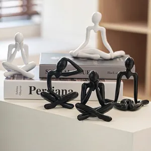 Minimalist abstract figure sculptures in black and white for modern home art decor