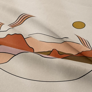 Close-up of bohemian wall tapestry showing textured fabric with abstract sun and mountains