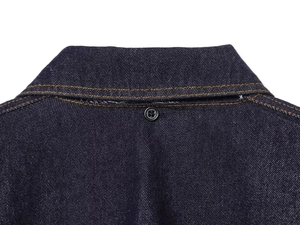 Macro view of dark blue denim cape top with classic double orange stitching and button detail