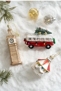 Detailed blown glass Christmas ornaments featuring a Big Ben shape and vintage red van