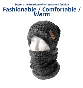 Close-up of dark grey knitted beanie and scarf set with thick warm fleece lining and sports patch
