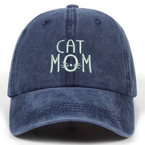 Washed navy cotton baseball cap featuring unique CAT MOM embroidery on white background
