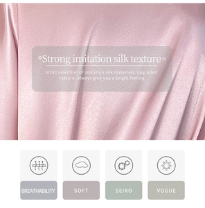 Gros plan sur le tissu en imitation soie rose montrant sa texture lisse et soyeuse