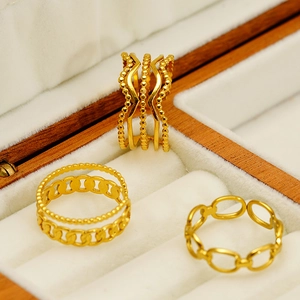 Three-piece gold-plated link chain open rings set on a white velvet jewelry box