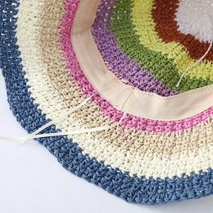 Detailed close-up of rainbow crochet sun hat featuring an adjustable inner sweatband