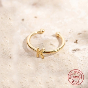 Adjustable S925 sterling silver ring featuring a polished gold letter K initial design
