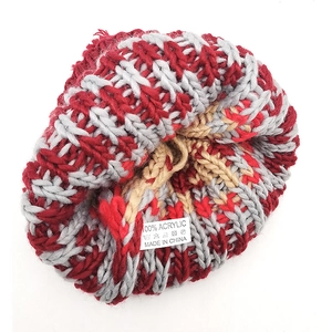 Inside view of a winter knit beanie showing 100% acrylic material tag and soft lining