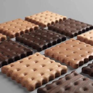 Minimalist biscuit shaped walnut wood coasters with natural grain in grid arrangement