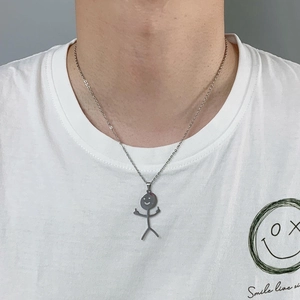 Funny stickman doodle pendant necklace in silver stainless steel worn by a model