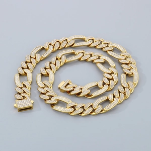 Close-up of gold iced-out Cuban link necklace with crystal pavé and square clasp
