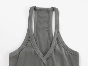 Detail of V-neck stitching and ribbed fabric texture on dark grey tank top