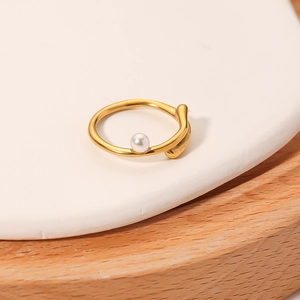 Irregular 18k gold plated stainless steel ring with a freshwater pearl on a stone base