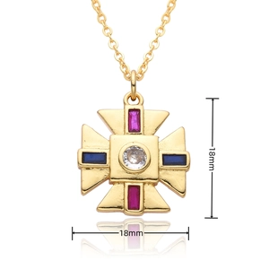 Detailed view of an 18mm gold cross pendant necklace with red and blue gemstones