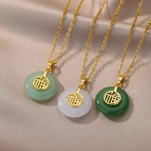 Three elegant lucky Fu charm necklaces in jade green and white with gold chains