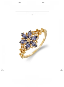 Detailed macro view of S925 silver ring with 14K gold plating and tanzanite zircon cluster