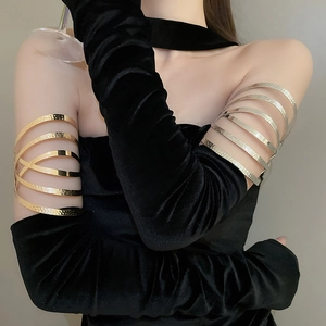 Irregular multilayer metal cuff armlet featuring hammered texture over black gloves