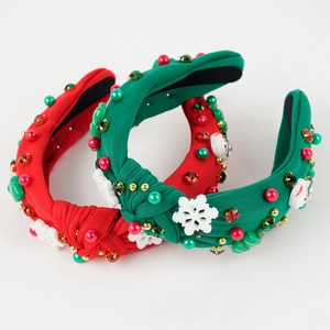 Detail of Christmas headband with colorful rhinestones, mini tree, and snowflake ornaments