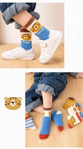 Close-up of tiger jacquard pattern and ribbed cuffs on kids' cotton mesh socks