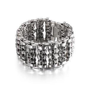 Polished stainless steel punk skull bracelet for men in silver finish on white background