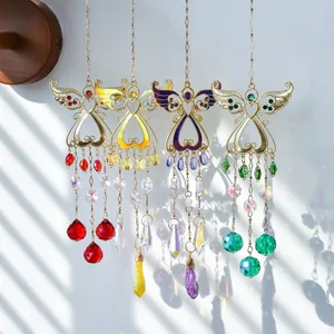 Set of four angel wing suncatchers with colorful crystals and golden heart frames