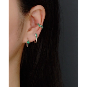 Minimalist S925 sterling silver twist drop earrings featuring green gemstones on model