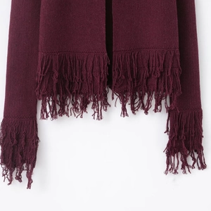 Burgundy knit cardigan featuring bohemian long fringe trim on hem and sleeves
