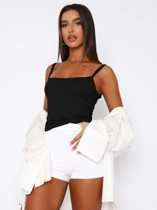 Detail of black ribbed camisole top with delicate lace trim and thin shoulder straps