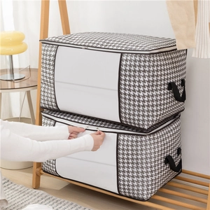 Set of 2 houndstooth quilt storage bags with transparent windows and handles on a wooden rack
